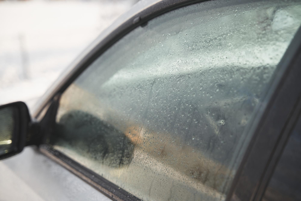 Fogged-up car windows: side window of a car