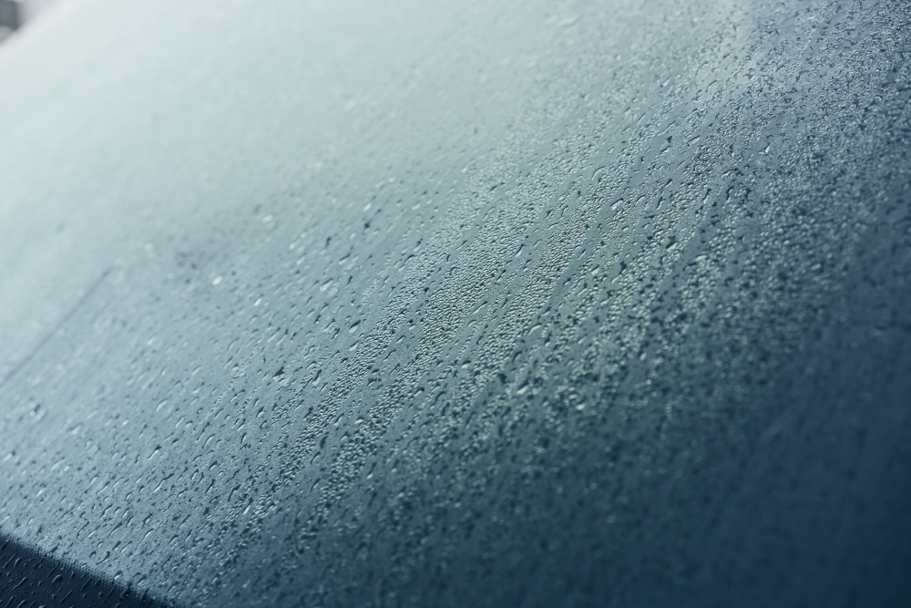 Fogged-up car windows: water droplets impairing visibility